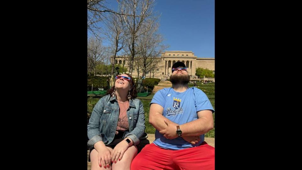 Meghann Henry with her husband, Micah Schuele, watching the eclipse at the Nelson-Atkins Museum of Art. The last time an eclipse passed through Kansas City in 2017, the two hadn’t met each other.