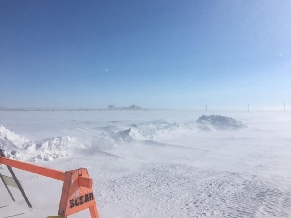 This April 2017 photo provided by the U.S. Environmental Protection Agency shows an oil well that was misting natural gas on Alaska's frozen North Slope. Workers from the Alaska Department of Conservation and the Environmental Protection Agency on Saturday, April 15, 2017, were able to connect hoses to valves that allow pressure in the well to be reduced, according to a statement from the state conservation department. The Environmental Protection Agency says a crack in the BP wellhead near Deadhorse sent up mist of crude oil Friday before it froze over and an initial leak stopped. (U.S. Environmental Protection Agency via AP)