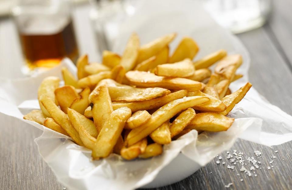 <p>Burgers and french fries are an <a href="https://www.thedailymeal.com/eat/most-famous-best-fast-food-menu-items?referrer=yahoo&category=beauty_food&include_utm=1&utm_medium=referral&utm_source=yahoo&utm_campaign=feed" rel="nofollow noopener" target="_blank" data-ylk="slk:iconic fast food;elm:context_link;itc:0;sec:content-canvas" class="link ">iconic fast food</a> duo that’s easy to recreate at home, but that doesn’t mean a fresh batch of deep-fried potatoes will work in the yard. When french fries and other fried foods sit outside on the buffet table, they can get cold and soggy fast. Instead, try serving <a href="https://www.thedailymeal.com/best-recipes/slow-cooker-baked-beans-with-bacon?referrer=yahoo&category=beauty_food&include_utm=1&utm_medium=referral&utm_source=yahoo&utm_campaign=feed" rel="nofollow noopener" target="_blank" data-ylk="slk:baked beans;elm:context_link;itc:0;sec:content-canvas" class="link ">baked beans</a> and <a href="https://www.thedailymeal.com/recipes/grilled-corn-chile-garlic-butter?referrer=yahoo&category=beauty_food&include_utm=1&utm_medium=referral&utm_source=yahoo&utm_campaign=feed" rel="nofollow noopener" target="_blank" data-ylk="slk:grilled corn;elm:context_link;itc:0;sec:content-canvas" class="link ">grilled corn</a> as sides.</p>