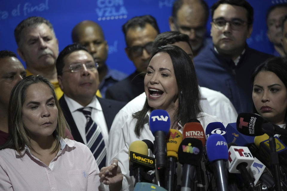 Opposition leader María Corina Machado speaks during a press conference regarding the arrest order for her campaign manager and eight other opposition members for alleged involvement in a conspiracy plot to destabilize the government, in Caracas, Venezuela, Wednesday, March 20, 2024. Machado has been disqualified from holding public office for 15 years but has continued to campaign for president ahead of the July 28 elections. (AP Photo/Ariana Cubillos)