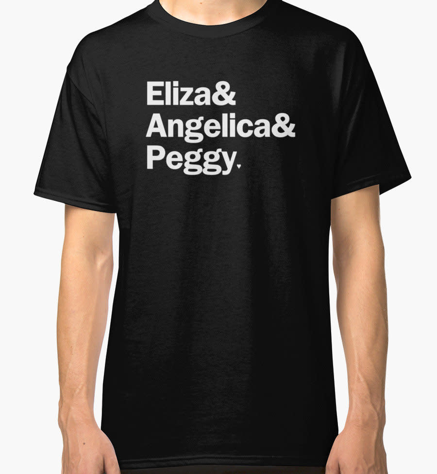 $23.36. <a href="https://www.redbubble.com/people/gillianembers/works/21794182-hamilton-eliza-and-angelica-and-peggy-black?grid_pos=32&amp;p=classic-tee" target="_blank">Buy it here</a>.