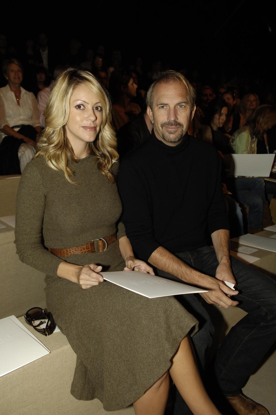 Christine Baumgartner (L) and Kevin Costner attend Chloe's spring 2007 runway show at the Espace Ephemere Tuileries. (Photo by Fairchild Archive/Penske Media via Getty Images)
