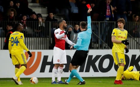 Arsenal's Alexandre Lacazette is shown a red card by referee Srdjan Jovanovic - Credit: Reuters