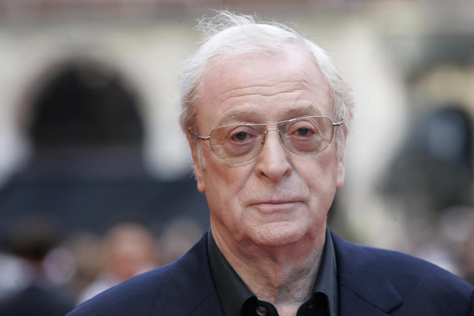 FILE - In this July 21, 2008, file photo, British actor Michael Caine arrives for the European Premiere of 'The Dark Knight', in central London. For the past three decades, many Britons had hoped the rigid class system that defined their country from Dickens to “Downton Abbey” was finally dying. Now they fear that class, their old bugbear, is back on the rise. A recent Sunday Telegraph story with the headline "young, gifted and posh" said Britain's oldest private schools, such as all-male Eton and Harrow, had become a "production line of young talent," including "Homeland" star Damian Lewis, Benedict Cumberbatch of "Sherlock" and Dominic West of “The Wire.” (AP Photo/Joel Ryan, File)
