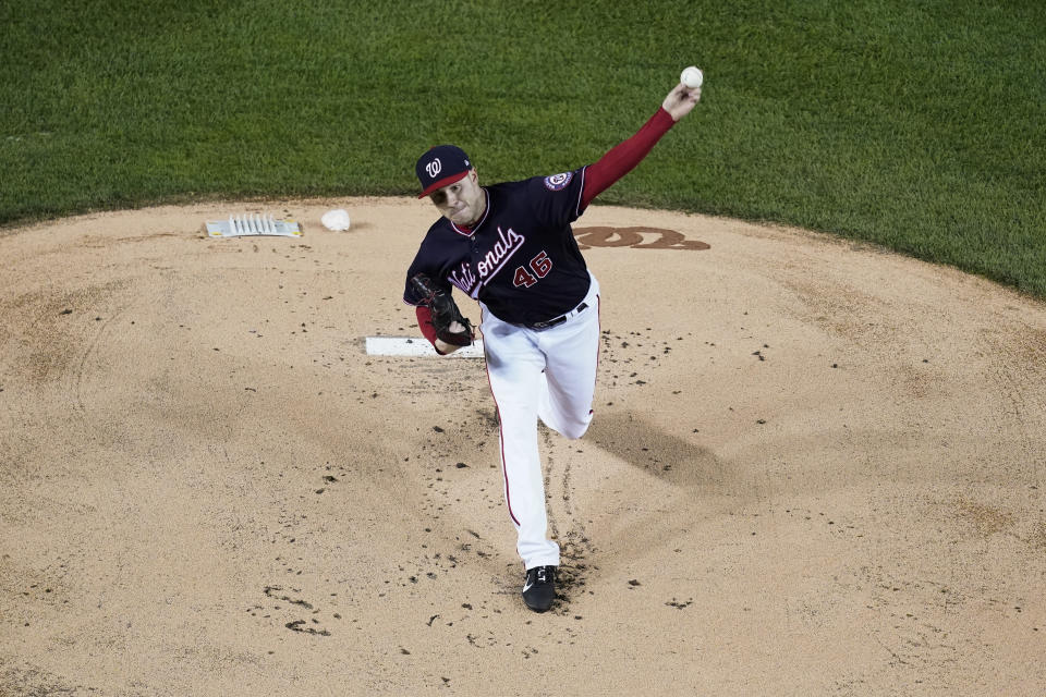 FILE - Washington Nationals starting pitcher Patrick Corbin throws during the first inning of Game 4 of the baseball World Series against the Houston Astros, Saturday, Oct. 26, 2019, in Washington. Corbin -- a 33-year-old in the fifth year of a six-year, $140 million contract -- will be on the mound, making a second consecutive opening day start for a rotation missing World Series MVP Stephen Strasburg and top prospect Cade Cavalli because of injuries and trying to find young pieces around whom to rebuild.(AP Photo/Pablo Martinez Monsivais, File)