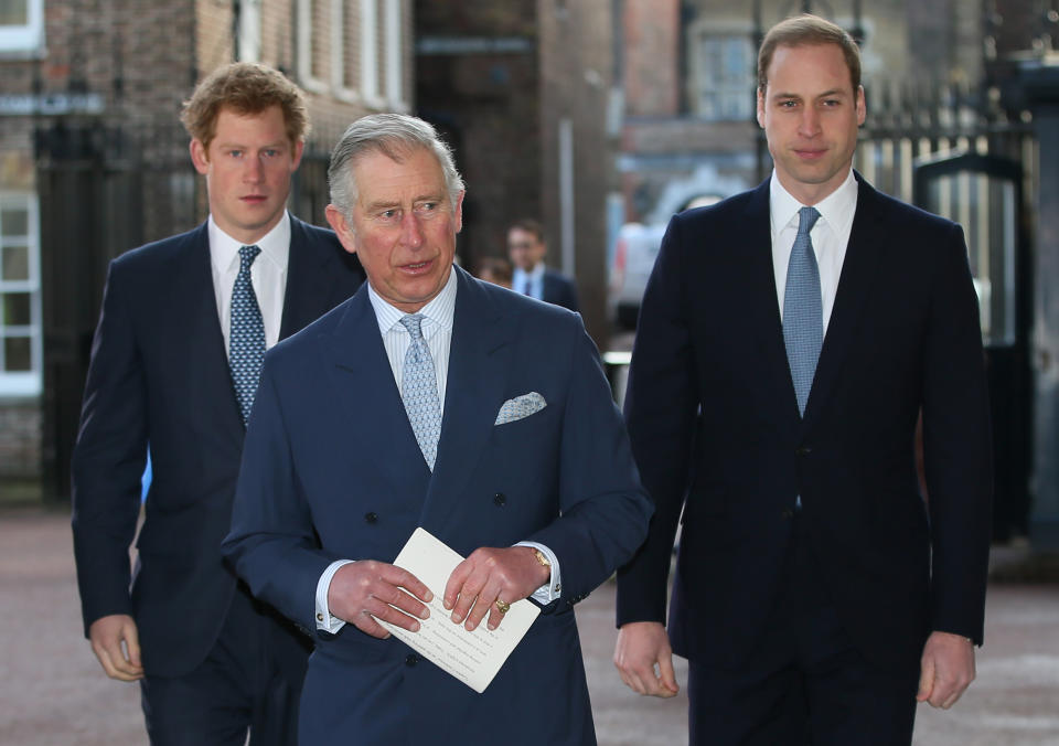 Britain's Prince Charles, center, with his sons Prince William, right, and Prince Harry walk to Lancaster House to attend the Illegal Wildlife Trade Conference in London, Thursday, Feb. 13, 2014. (AP Photo/Alastair Grant, Pool)