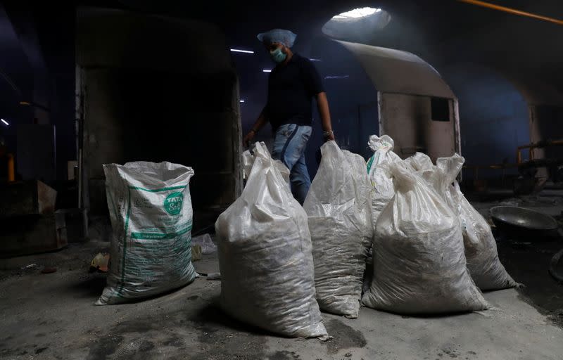 Bags containing unclaimed ashes of victims who died from the coronavirus disease (COVID-19), are seen at a crematorium in New Delhi