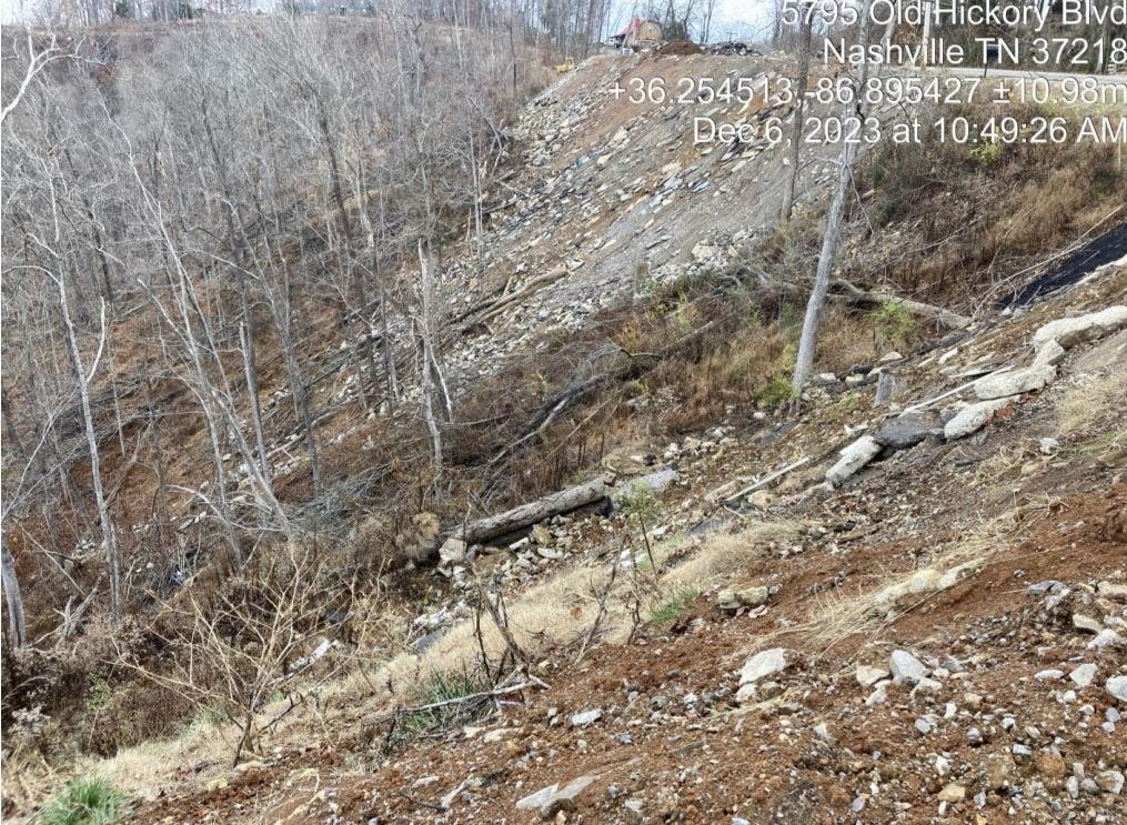 Debris and fill covers a hillside at a property near Beaman Park in Nashville.