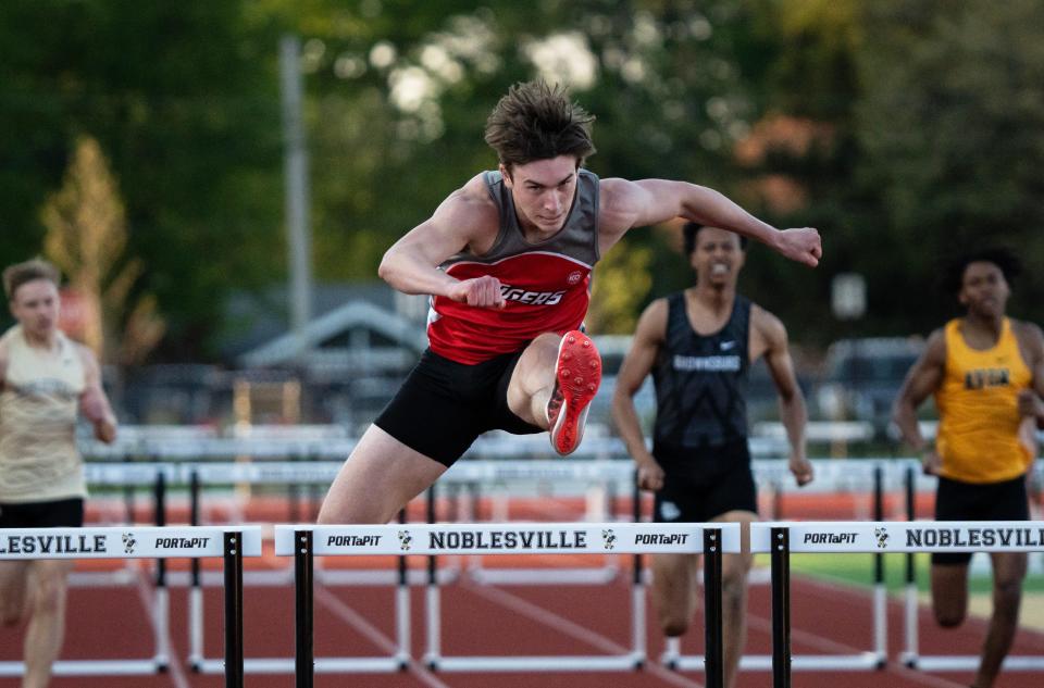 Fishers junior Tyler Tarter runs the 110m hurdles Thursday, May 4, 2023, during the Hoosier Crossroads Conference boys track and meet at Noblesville High School in Noblesville, Ind.