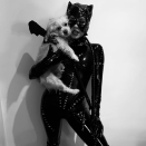 <p>As Catwoman.</p><p>Hudgens debuted this costume on October 2, writing <a href="https://www.instagram.com/p/CF2m6qHhs5s/" rel="nofollow noopener" target="_blank" data-ylk="slk:on her Instagram;elm:context_link;itc:0;sec:content-canvas" class="link ">on her Instagram</a>, "Who needs a Batman when u can have a Batdog 😂🖤"</p>