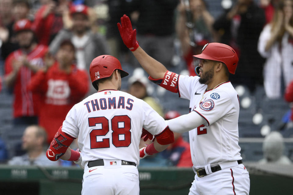 Washington Nationals' Lane Thomas (28) celebrates his home run with Luis Garcia during the third inning of a baseball game against the Arizona Diamondbacks, Thursday, June 22, 2023, in Washington. (AP Photo/Nick Wass)