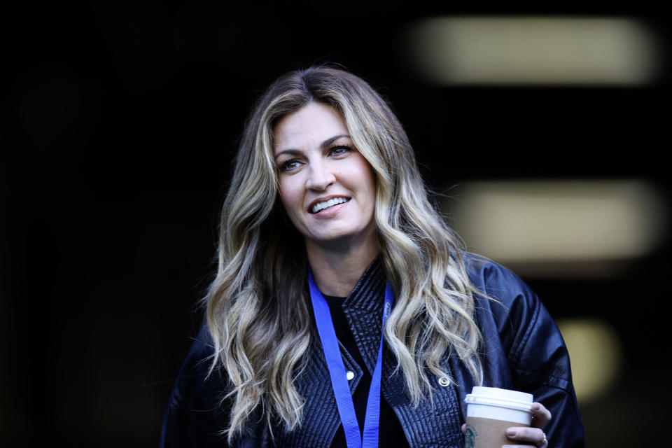 Erin Andrews holding a cup of coffee.