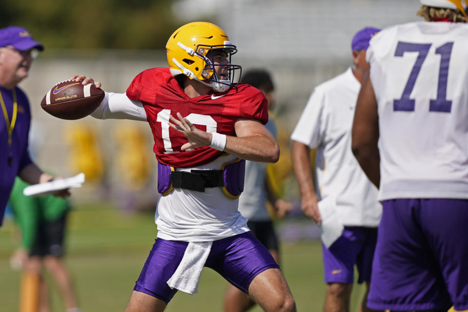 LSU quarterback Garrett Nussmeier (13) passes during their NCAA college football practice in Baton Rouge, La., Monday, Aug. 15, 2022. LSU quarterback Myles Brennan announced Monday that he has decided to end his college football career after five seasons with the Tigers. (AP Photo/Gerald Herbert)