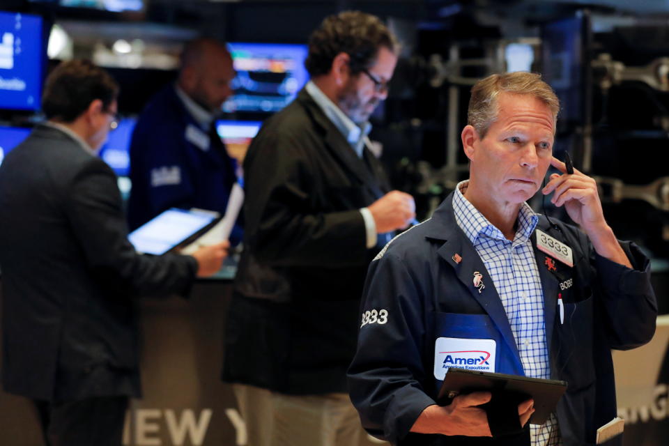 Traders work on the floor at the New York Stock Exchange (NYSE) in Manhattan, New York City, U.S., September 24, 2021. REUTERS/Andrew Kelly