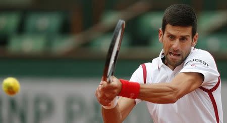 Tennis - French Open - Roland Garros - Novak Djokovic of Serbia v Roberto Bautista Agut of Spain - Paris, France - 31/05/16. Djokovic returns the ball. REUTERS/Gonzalo Fuentes