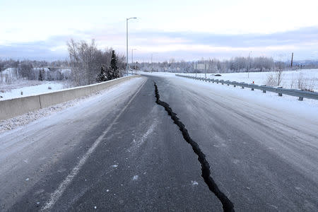 A crack which opened up along a roadway near the airport is seen after an earthquake in Anchorage, Alaska, U.S. November 30, 2018. REUTERS/Nathaniel Wilder