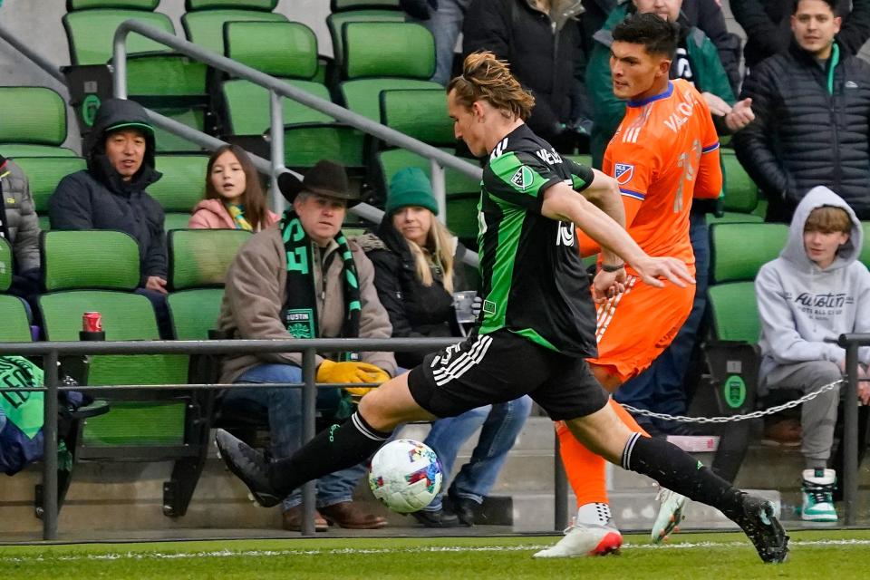 Feb 26, 2022; Austin, Texas, USA; Austin FC midfielder Kipp Keller (15) and FC Cincinnati forward Brandon Vazquez (19) battle for the ball during the first half at Q2 Stadium.