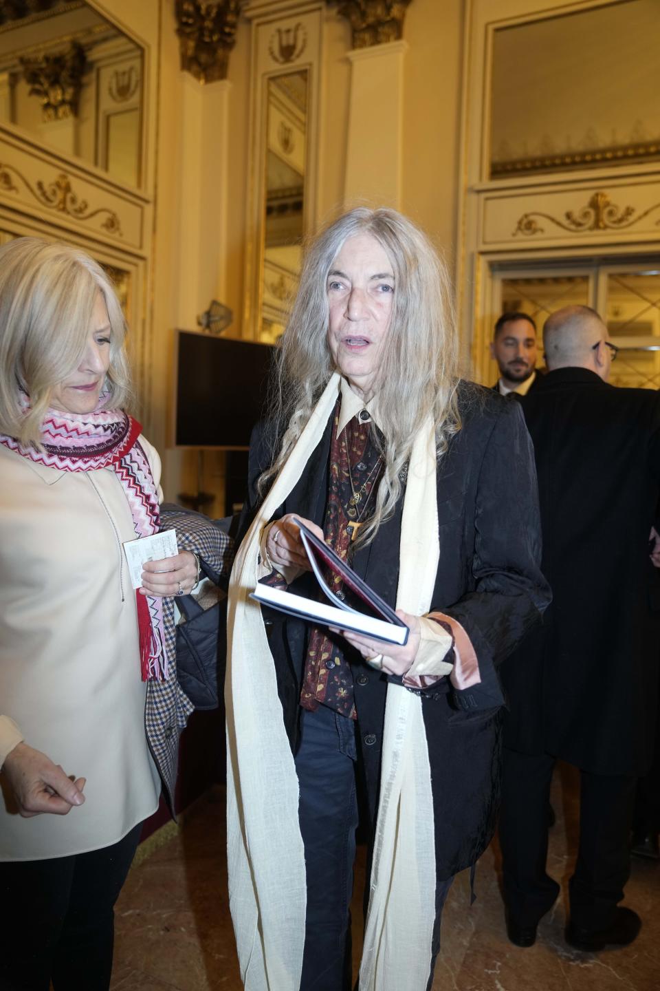 Patti Smith arrives to attend La Scala opera house's gala season opener, Giuseppe Verdi's opera 'Don Carlo' at the Milan La Scala theater, Italy, Thursday Dec. 7, 2023. The season-opener Thursday, held each year on the Milan feast day St. Ambrose, is considered one of the highlights of the European cultural calendar. (AP Photo/Luca Bruno)