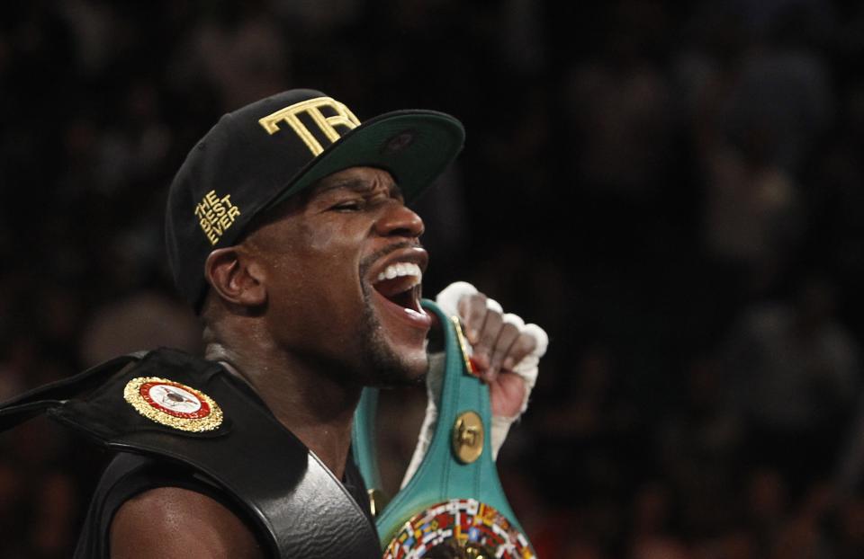 Floyd Mayweather Jr. of the U.S. celebrates his victory over WBC/WBA 154-pound champion Canelo Alvarez at the MGM Grand Garden Arena in Las Vegas, Nevada, September 14, 2013. Alvarez was previously undefeated in 42 fights. (REUTERS/Steve Marcus)