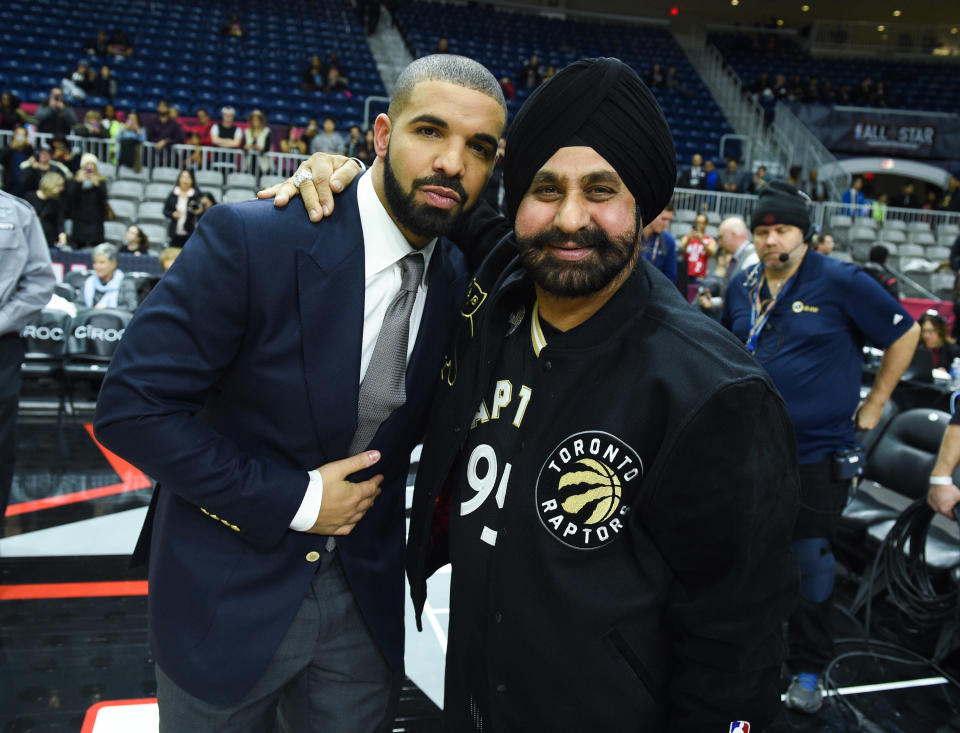 TORONTO, ON - FEBRUARY 12: Drake and Raptors Superfan Nav Bhatia attend the 2016 NBA All-Star Celebrity Game at Ricoh Coliseum on February 12, 2016 in Toronto, Canada.  (Photo by George Pimentel/WireImage)