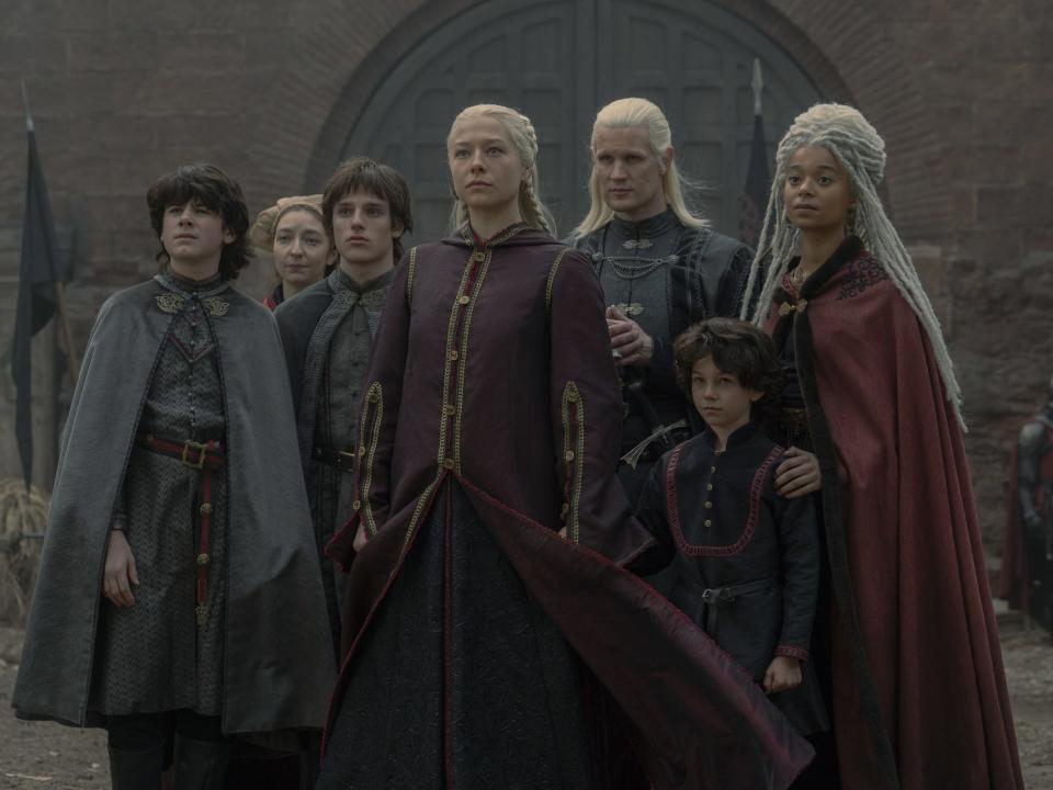 House Targaryen standing in a group in the castle courtyard.