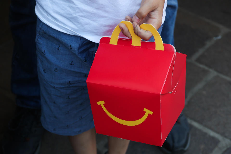 A child holds McDonald's Happy Meal box in Krakow, Poland on June 23, 2022. (Photo by Jakub Porzycki/NurPhoto via Getty Images)