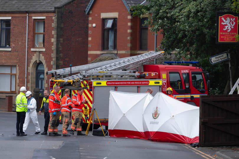 Fire crews and forensics have been working at the scene throughout the day -Credit:Manchester Evening News