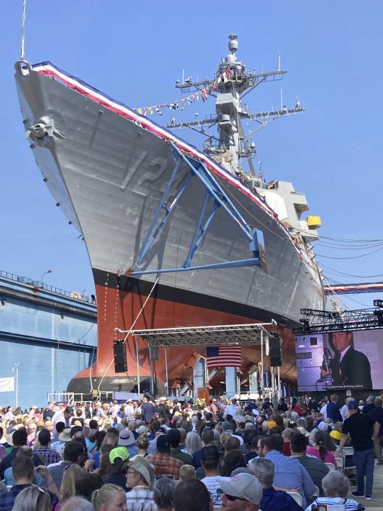 A crowd gathers to see the christening of a warship bearing the name of Medal of Honor recipient Barney Barnum at Bath Iron Works on Saturday, July 29, 2023, in Bath, Maine. (AP Photo/David Sharp)