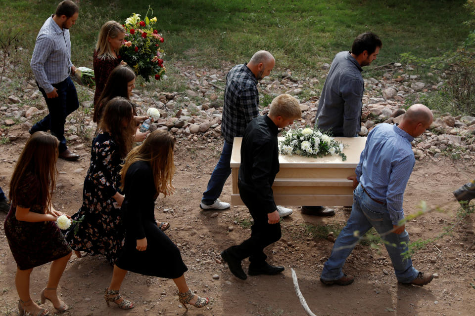 Men carry the remains of Dawna Ray Langford and her sons, Trevor and Rogan, who were killed by unknown assailants, to be buried at the cemetery in La Mora, Sonora , Mexico.