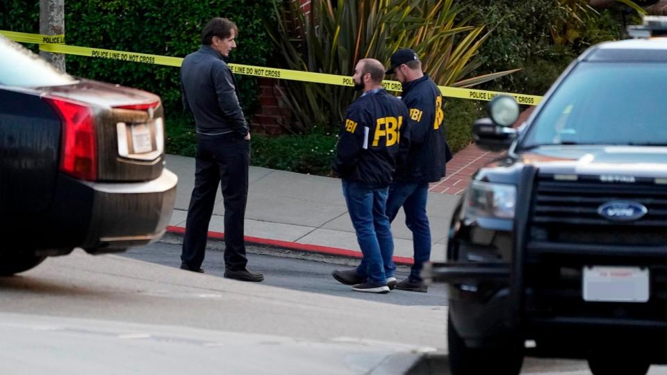 PHOTO: In this Oct. 28, 2022, file photo, a pair of FBI agents work outside the home of House Speaker Nancy Pelosi and her husband Paul Pelosi in San Francisco. (Eric Risberg/AP, FILE)