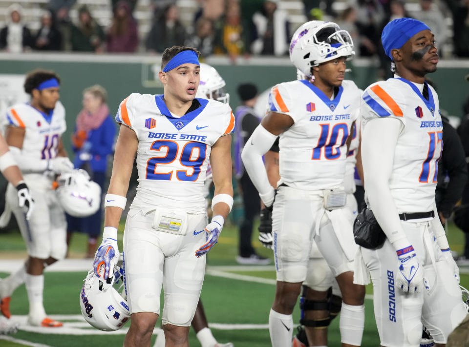 From left, Boise State safety Milo Lopez, linebacker Andrew Simpson and wide receiver Prince Strachan head off the field after losing on a last-second touchdown pass and extra point in an NCAA college football game against Colorado State on Saturday, Oct. 14, 2023, in Fort Collins, Colo. (AP Photo/David Zalubowski)