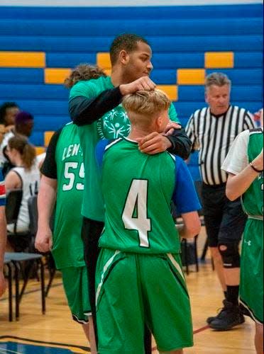 Ohio State's Roddy Gayle helps coach a Unified Sports basketball team at his alma mater, Youngstown (New York) Lewiston-Porter High School.