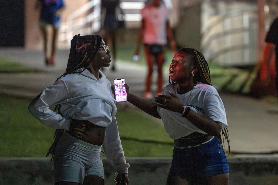 PHOTO: People are in shock after hearing multiple gun shots during a high school football game between Del City and Choctaw in Choctaw, Okla., on Aug. 25, 2023. (Alonzo Adams/The Oklahoman via USA Today Network)