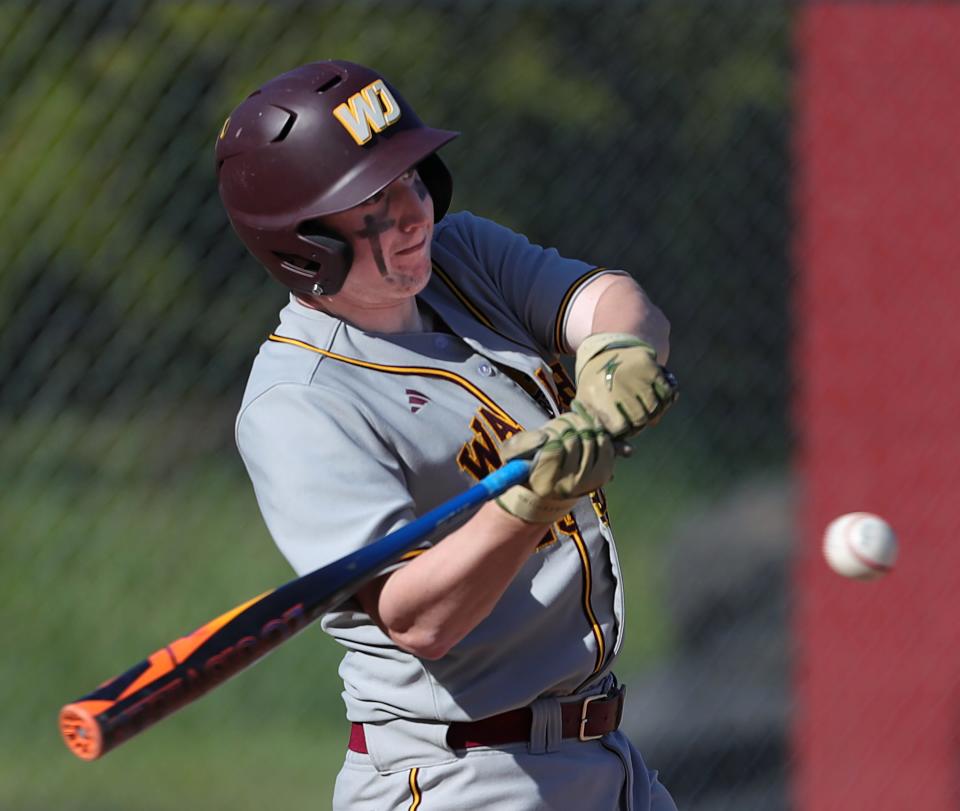 Walsh Jesuit's Zach Swiderski connects for a shot to right field April 22 in Cuyahoga Falls.