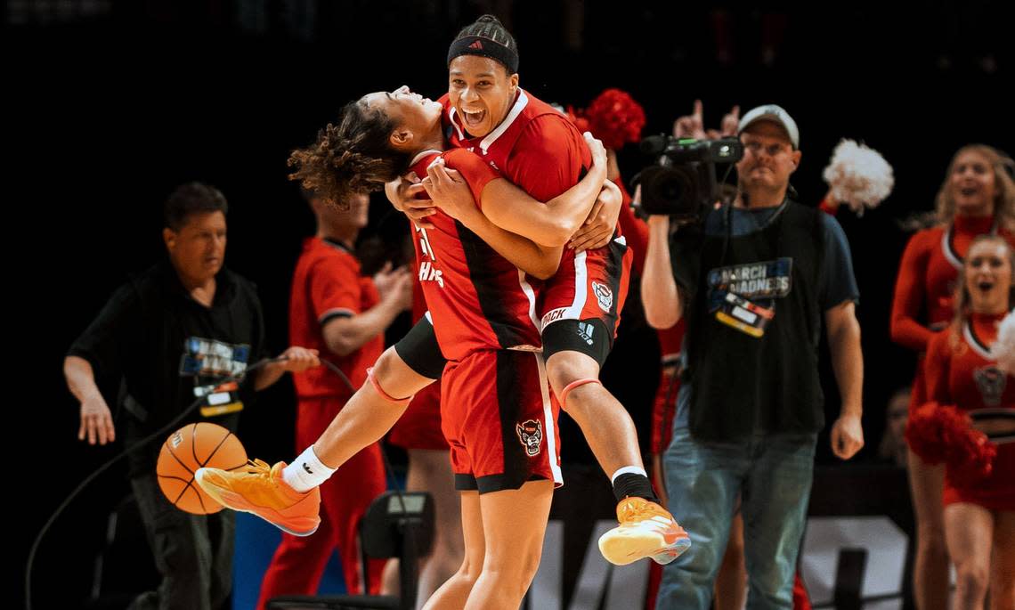 NC State’s Zoe Brooks leaps into the arms of Madison Hayes after defeating Stanford in their NCAA Sweet 16 game in Portland. Jaden Coleman