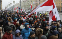 Protesters attend the procession in downtown Minsk, Belarus, Saturday, Dec. 7, 2019. More than 1,000 opposition demonstrators are rallying in Belarus to protest closer integration with Russia. Saturday's protest in the Belarusian capital comes as Belarusian President Alexander Lukashenko is holding talks with Russian President Vladimir Putin in Sochi on Russia's Black Sea coast. (AP Photo/Sergei Grits)