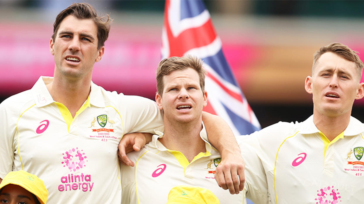 Pat Cummins, Steve Smith and Marnus Labuschagne sing the national anthem.