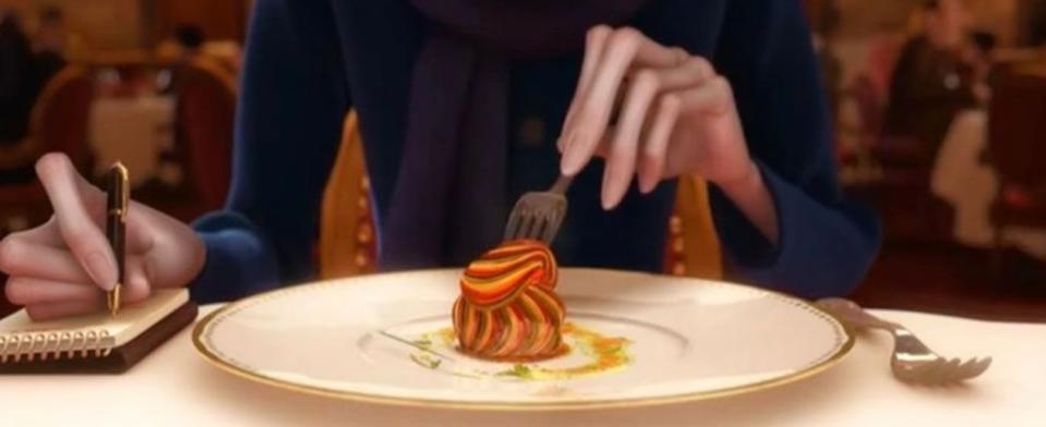 A close up of the ratatouille as someone sticks a fork in it