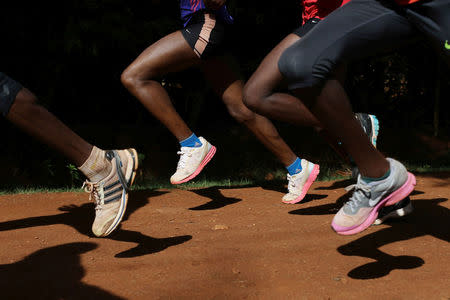 Athletes exercise in the early morning in Iten, near the town of Eldoret, western Kenya, March 21, 2016. REUTERS/Siegfried Modola