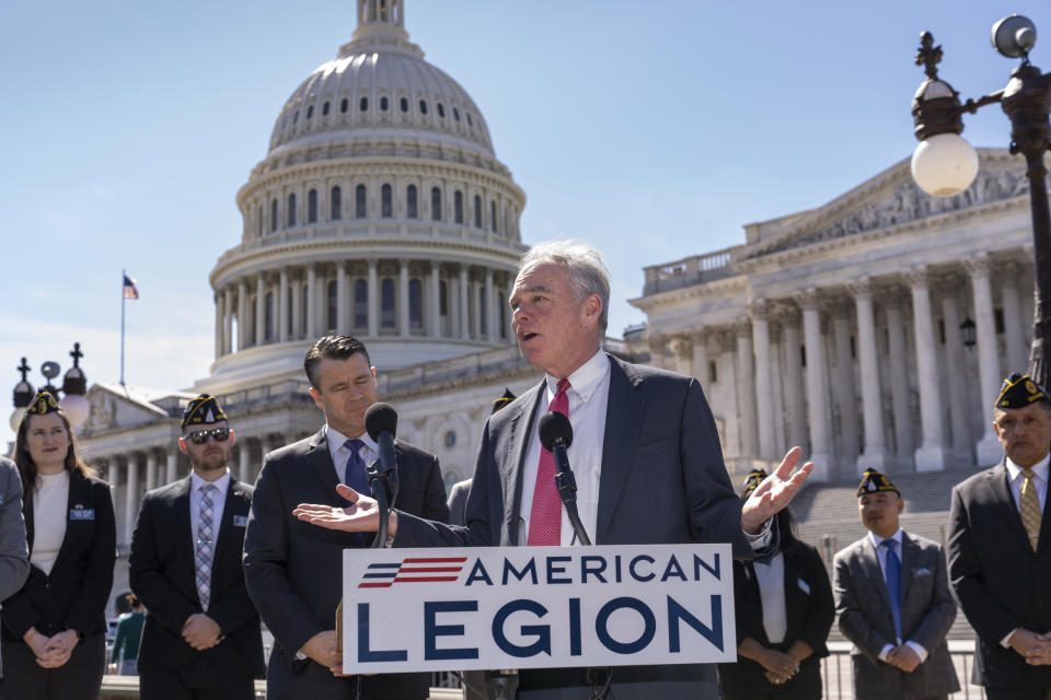 Sen. Tim Kaine, D-Va., center, and Sen. Todd Young, R-Ind., center left, are joined by representatives of the American Legion as they speak to reporters about ending the authorization for use of military force enacted after the Sept. 11, 2001 terrorist attacks, at the Capitol in Washington, Thursday, March 16, 2023. Senators voted 68-27 Thursday to move forward with a bill to repeal the 2002 measure that authorized the March 2003 invasion of Iraq and a 1991 measure that sanctioned the U.S.-led Gulf War to expel Iraqi leader Saddam Hussein's forces from Kuwait. (AP Photo/J. Scott Applewhite)