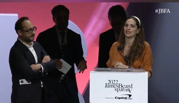 Chef Katie Button (right) and Felix Meana (left) accept the award for Outstanding Hospitality for Cúrate restaurant at the 2022 James Beard Awards in Chicago on June 13, 2022.