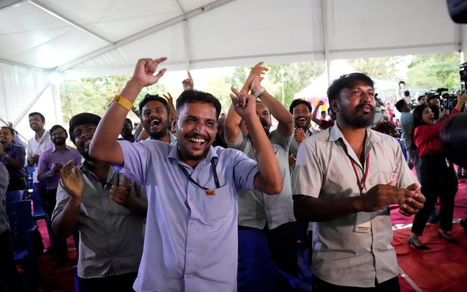 Indian Space Research Organization (ISRO) staff celebrate the successful landing of spacecraft Chandrayaan-3