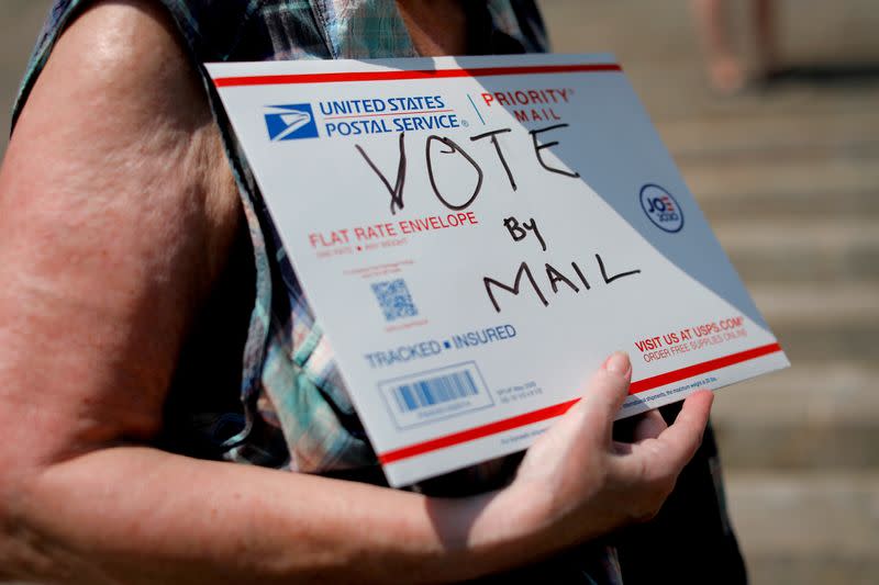 FILE PHOTO: U.S. Postal Service (USPS) workers rally to end mail delays and for the firing of U.S. Postmaster General Louis DeJoy in New York