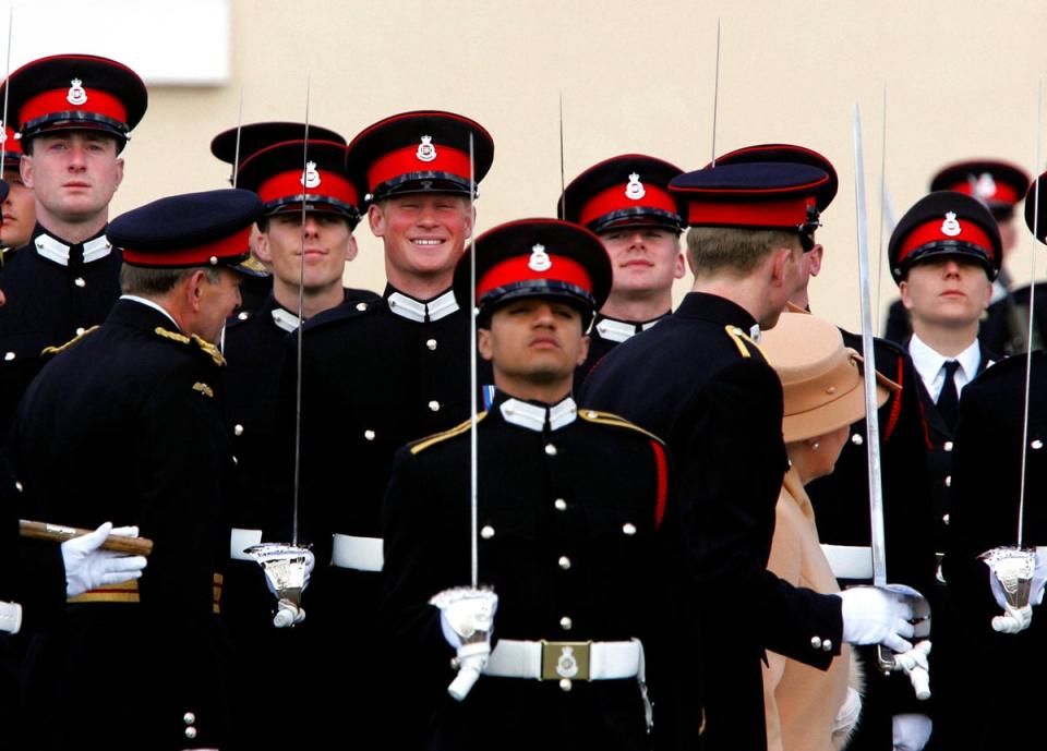 Harry smiling broadly as his grandmother the Queen reviewed him and other officers (Tim Ockenden/PA) (PA Archive)