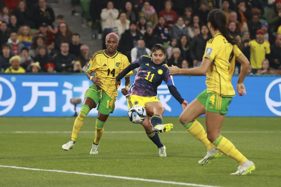 Colombia's Catalina Usme, center, scores her side's first goal during the Women's World Cup round of 16 soccer match between Jamaica and Colombia in Melbourne, Australia, Tuesday, Aug. 8, 2023. (AP Photo/Hamish Blair)
