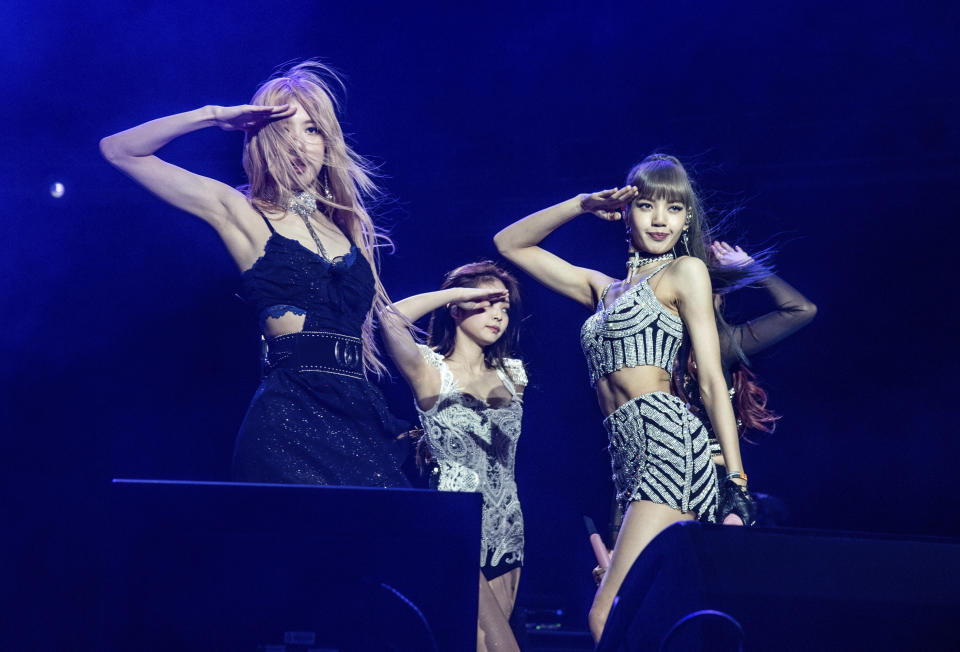 FILE - Rose, from left, Jenni Kim, and Lisa of Blackpink perform at the Coachella Music & Arts Festival in Indio, Calif. on April 12, 2019. Blackpink will headline at the 2023 Coachella Valley Music and Arts Festival. (Photo by Amy Harris/Invision/AP, File)