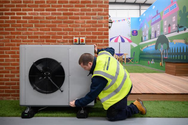 Workers train at a facility run by the heat pump startup Octopus Energy in Slough, England, last November. The company is betting big on the British government's mandates to ditch gas and oil boilers and generous incentives to install heat pumps. (Photo: Leon Neal via Getty Images)