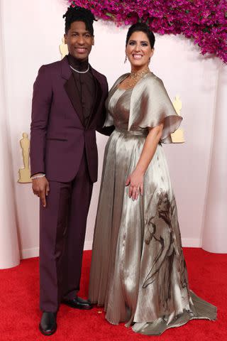 <p>Kevin Mazur/Getty </p> Jon Batiste and Suleika Jaouad Batiste at 2024 Oscars