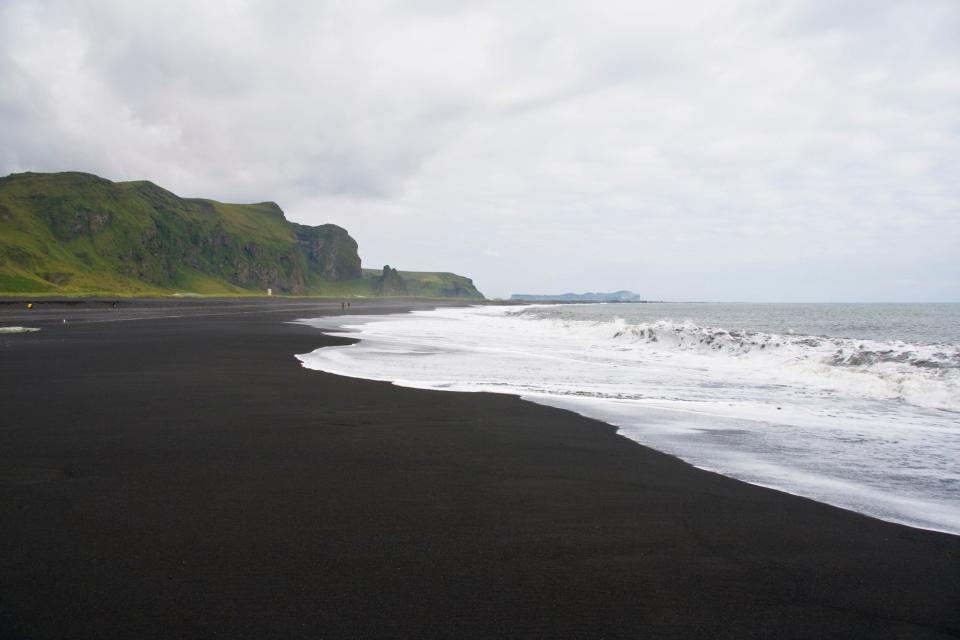 A view of the black-sand beach in Iceland.