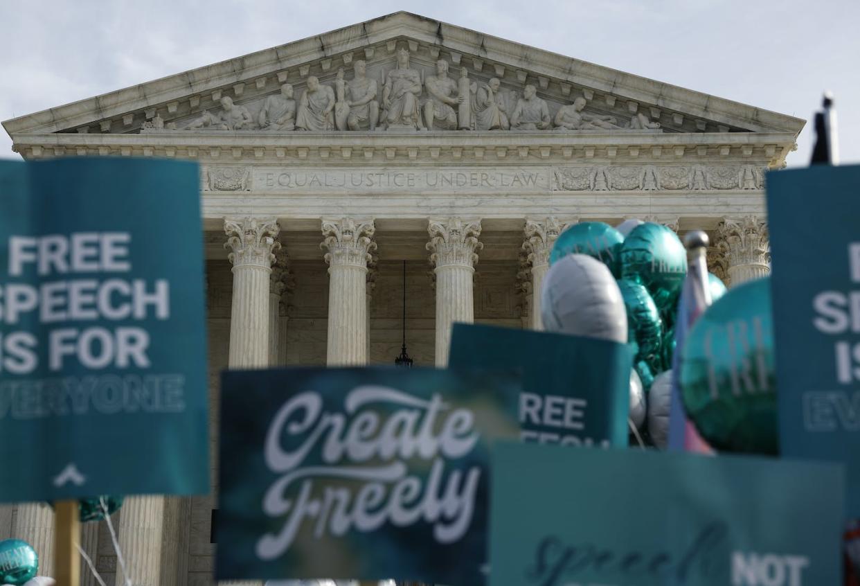 Supporters of web designer Lorie Smith, the owner of 303 Creative, demonstrate in front of the U.S. Supreme Court on Dec. 5, 2022. <a href="https://www.gettyimages.com/detail/news-photo/supporters-of-web-designer-lorie-smith-protest-in-front-at-news-photo/1446995982?adppopup=true" rel="nofollow noopener" target="_blank" data-ylk="slk:Anna Moneymaker/Getty Images;elm:context_link;itc:0;sec:content-canvas" class="link ">Anna Moneymaker/Getty Images</a>